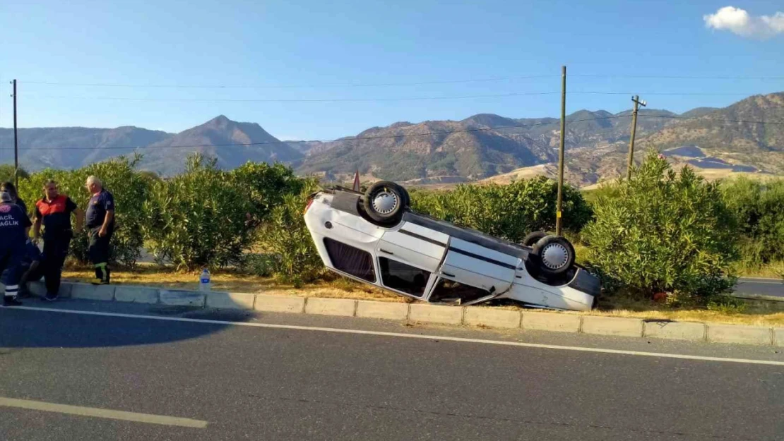 Takla atarak ters dönen otomobilden burunları kanamadan çıktılar