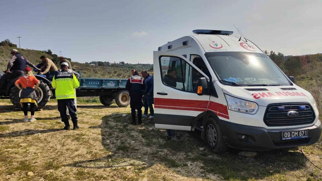 Tarlada devrilen traktörün üzerinden savrulan çiftçi yaralandı